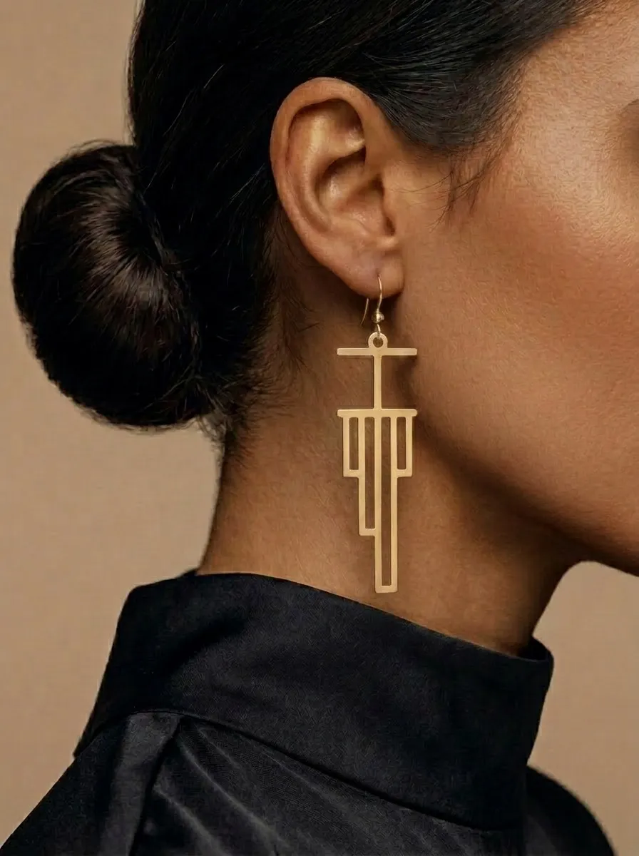 Recursion Earrings worn, brass